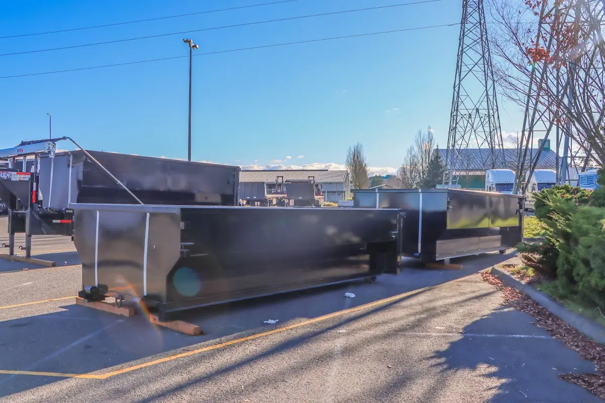 Roll-off dumpster ready for waste disposal at job site for Concrete Dumpster Rental in Albemarle